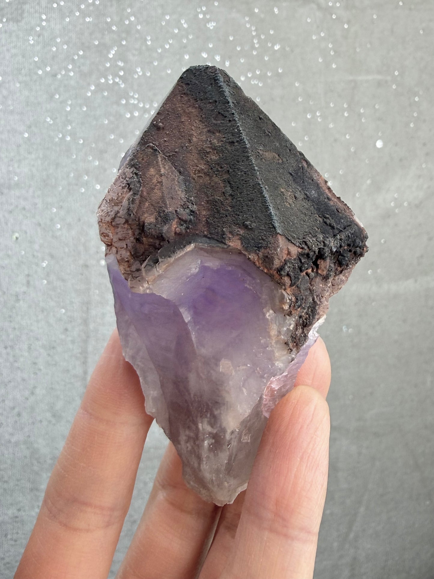 Dark amethyst with hematite and dark mineral inclusions