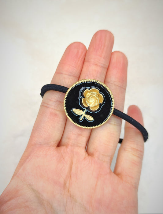 Svart blomst hårslips