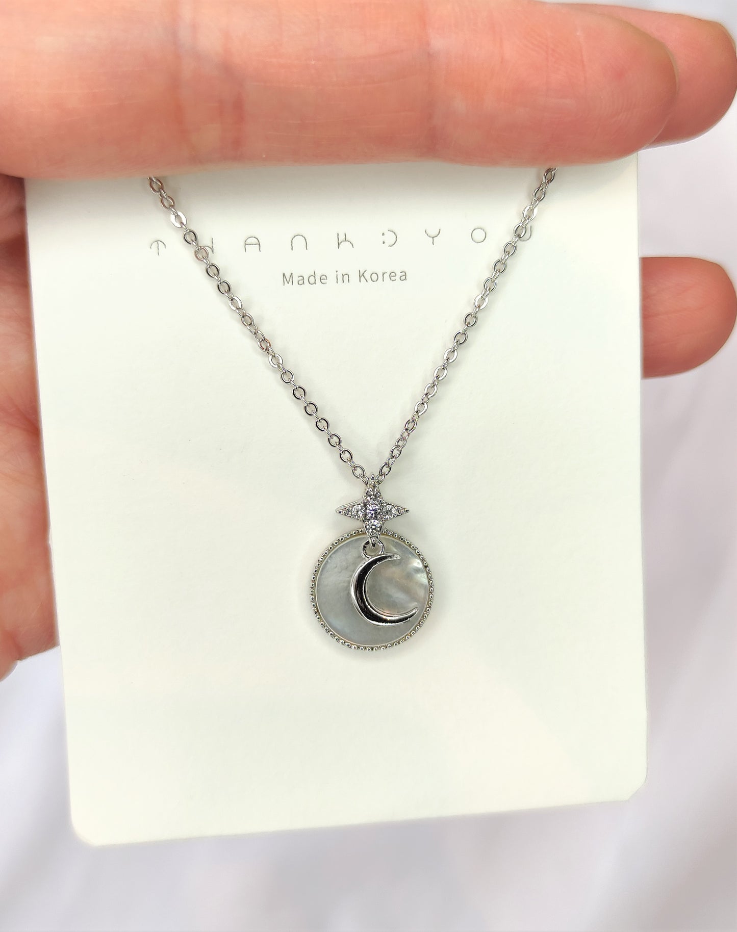 Halskjede med måne og stjerne