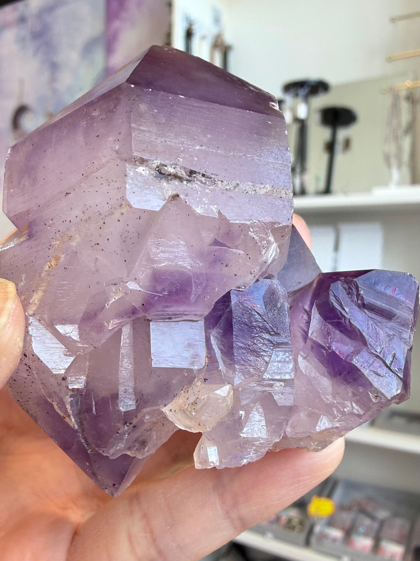 Natural elestial amethyst with skeletal structure and hematite inclusions
