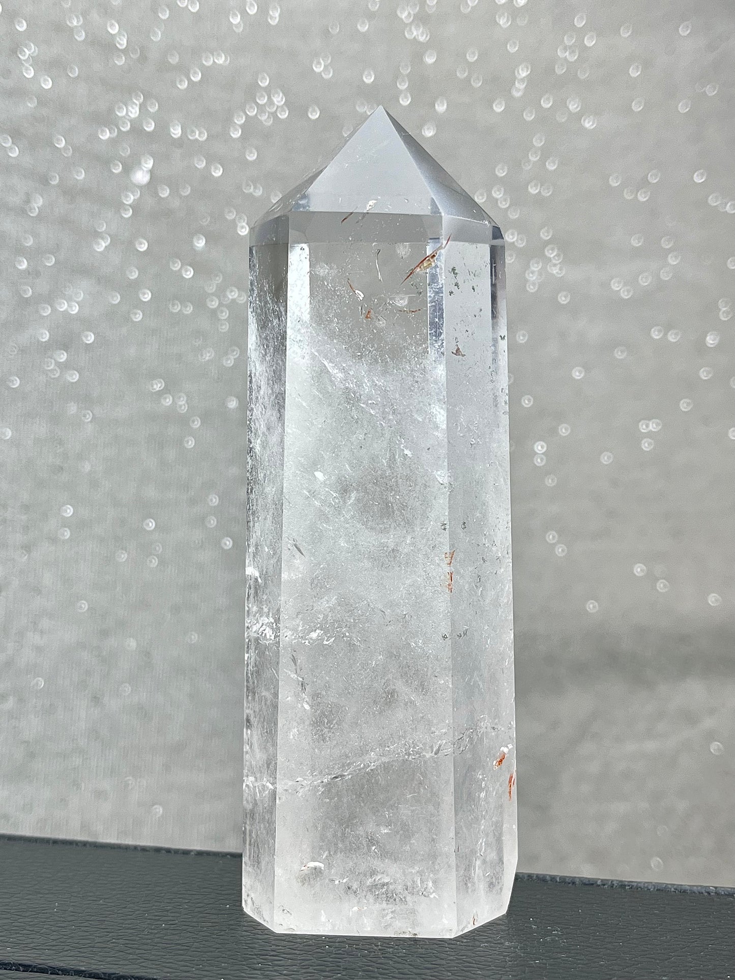 Rock crystal clear quartz with hematite tower