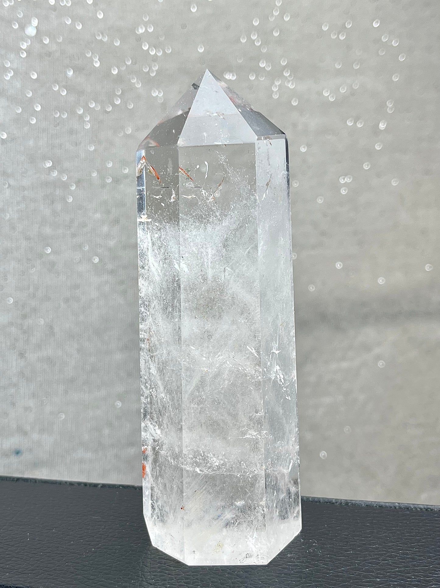 Rock crystal clear quartz with hematite tower