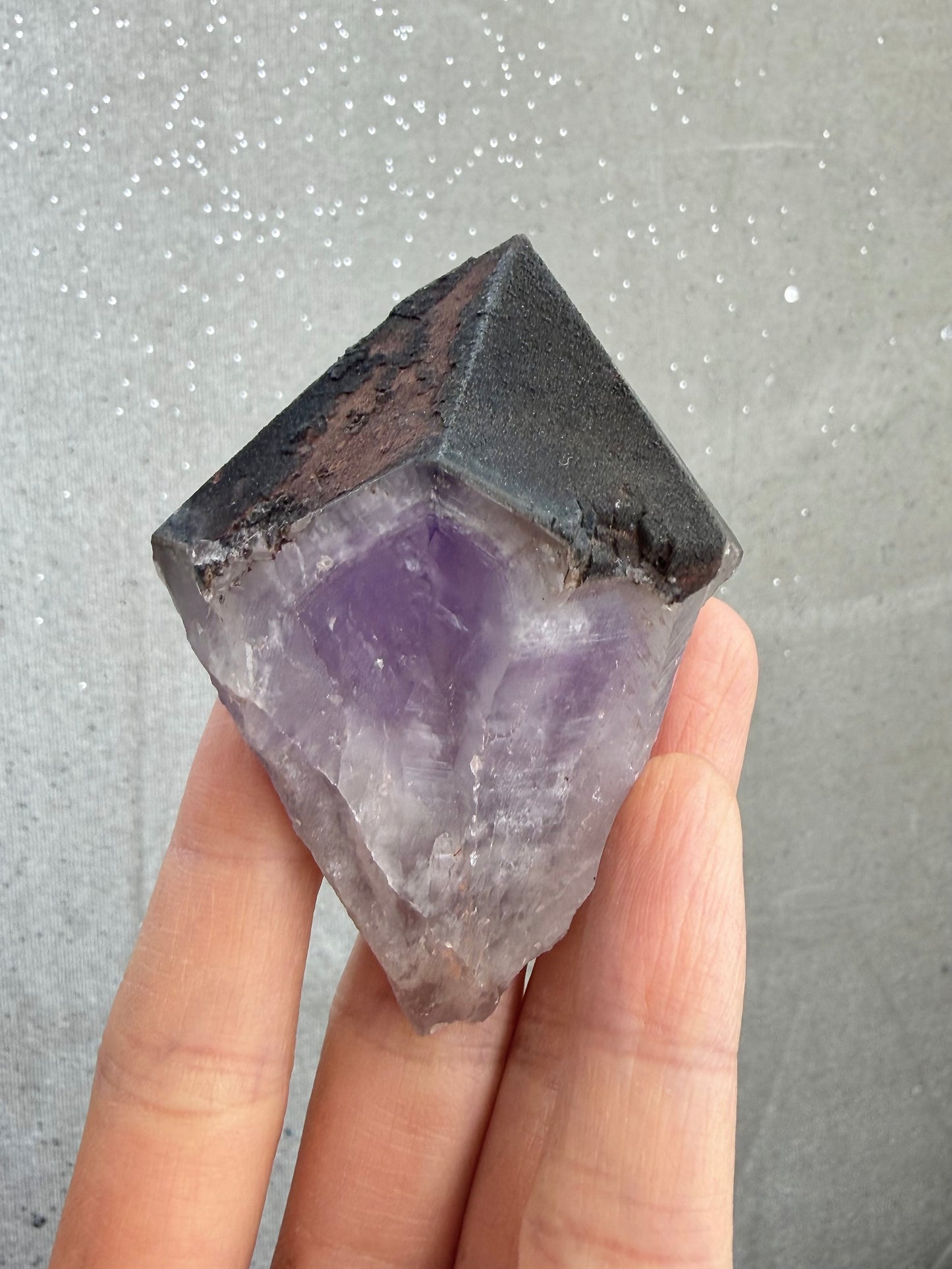 Dark amethyst with hematite and dark mineral inclusions