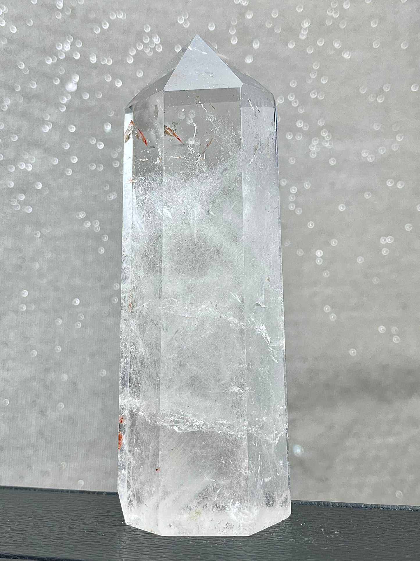 Rock crystal clear quartz with hematite tower
