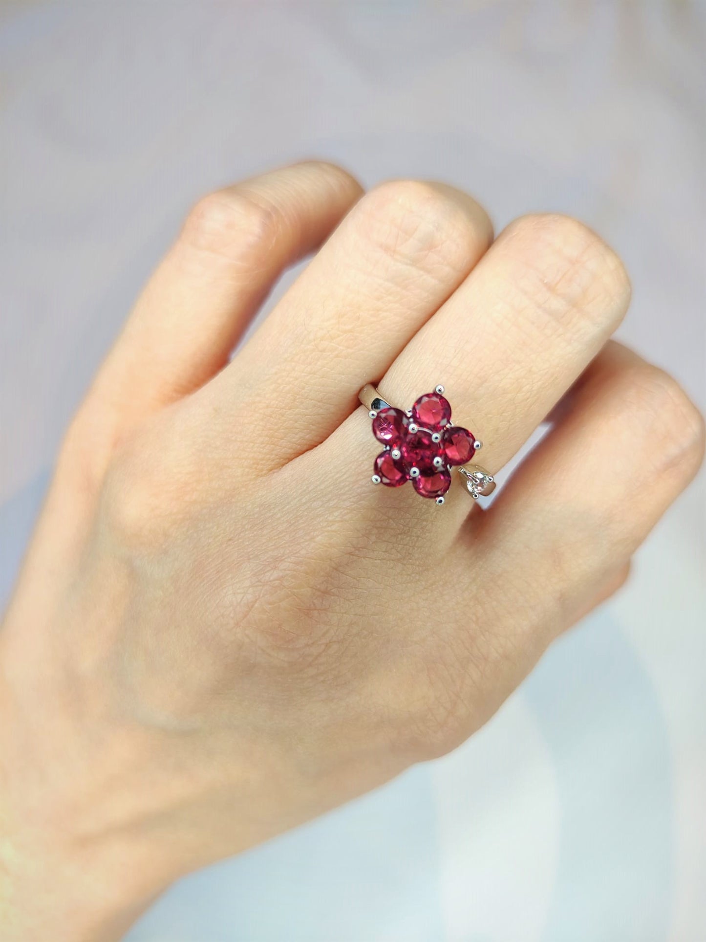 Rotate red flower ring